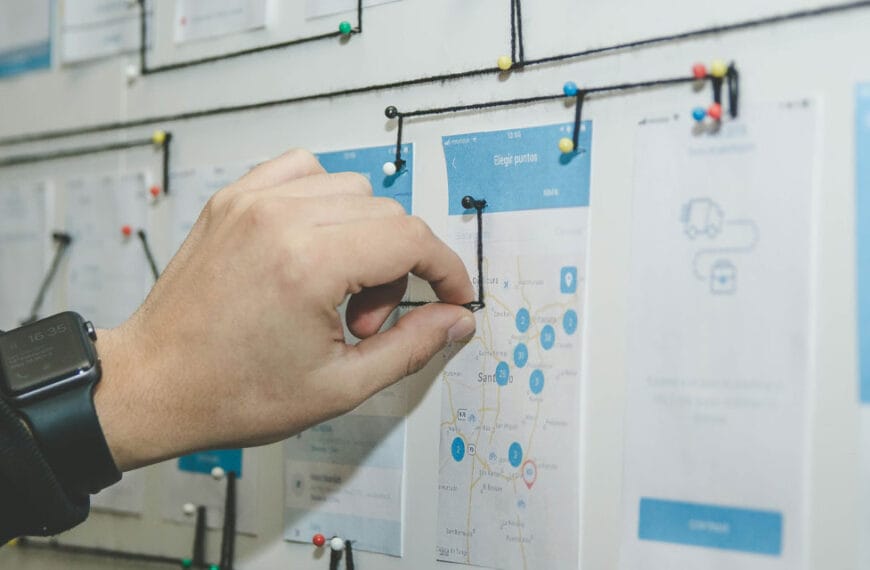 Person planning a website on a wall, using the site tree method.