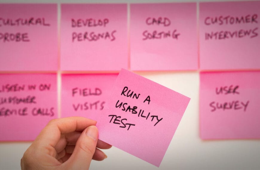 Whiteboard with post-it notes on the board. One reads "Book a usability test"